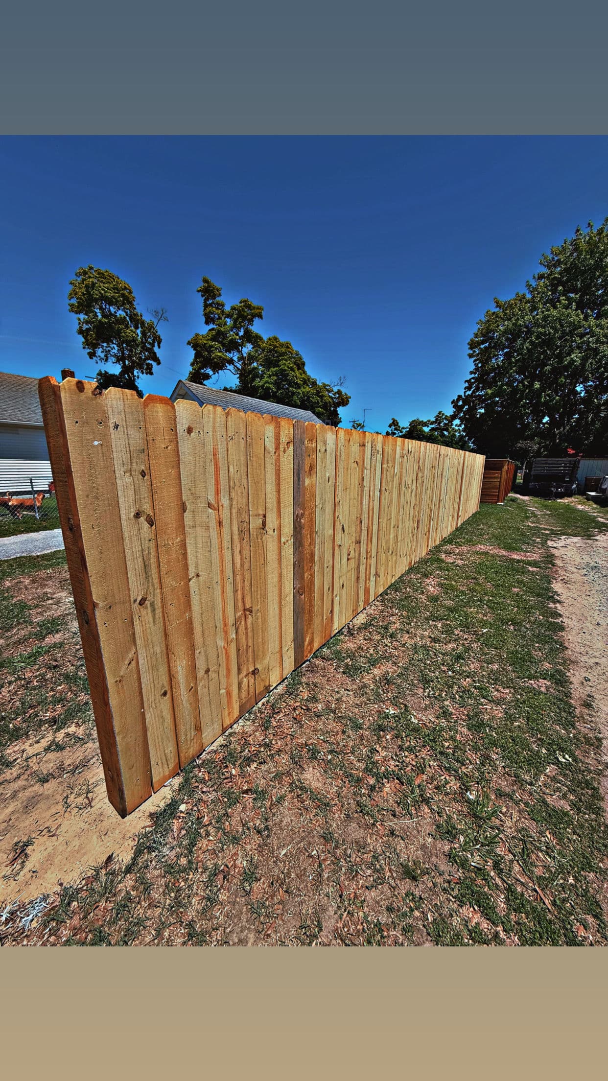 Pressure-Treated Wood Privacy Fence for a Family Backyard