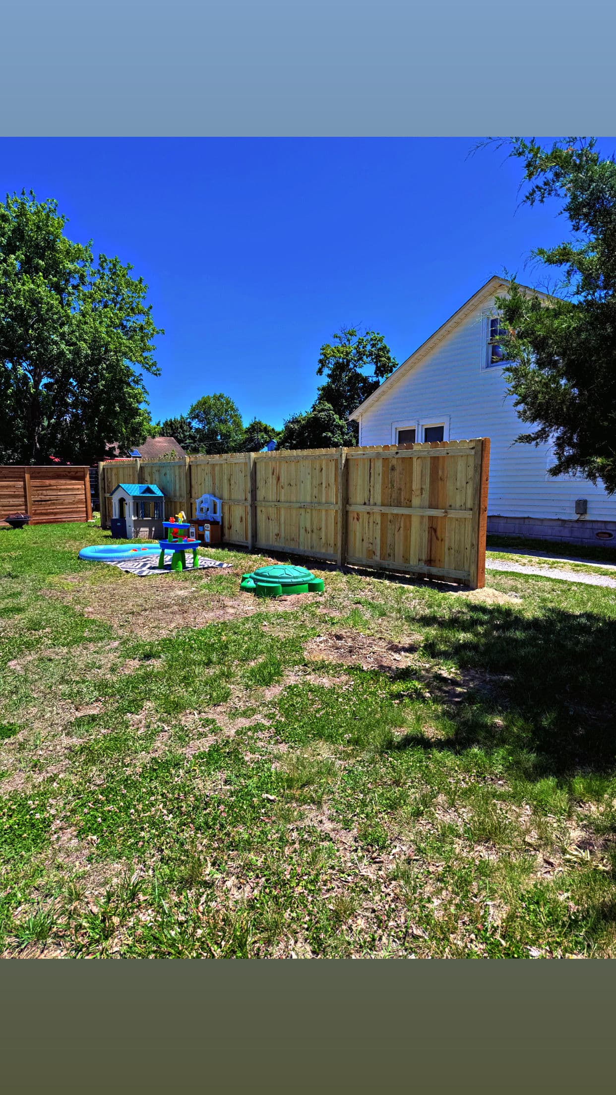 Pressure-Treated Wood Privacy Fence for a Family Backyard