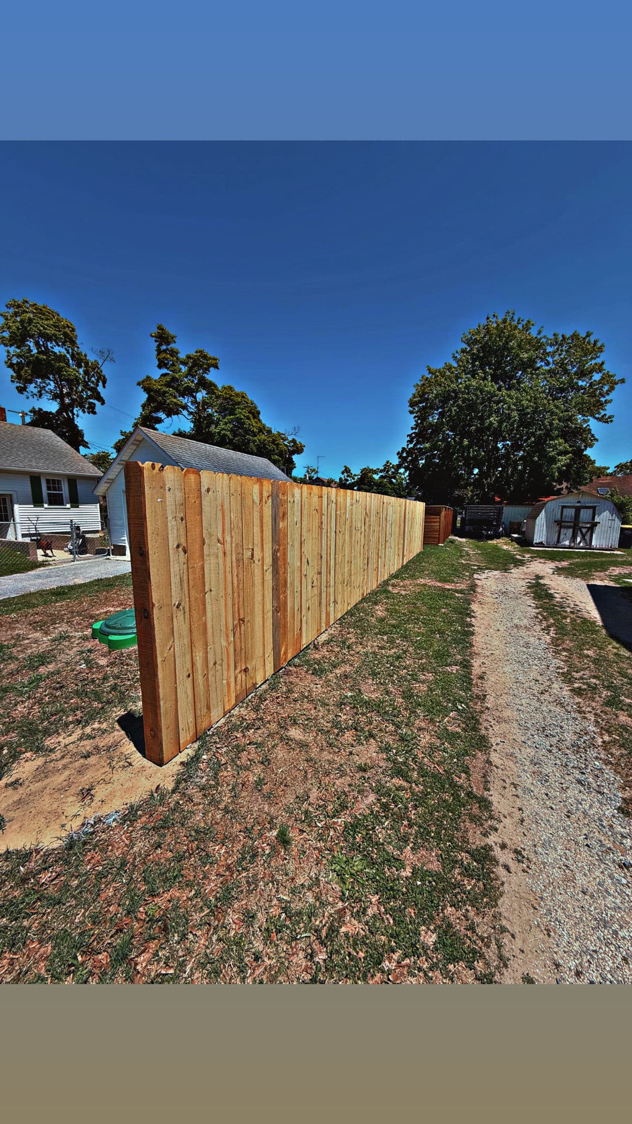 Pressure-Treated Wood Privacy Fence for a Family Backyard