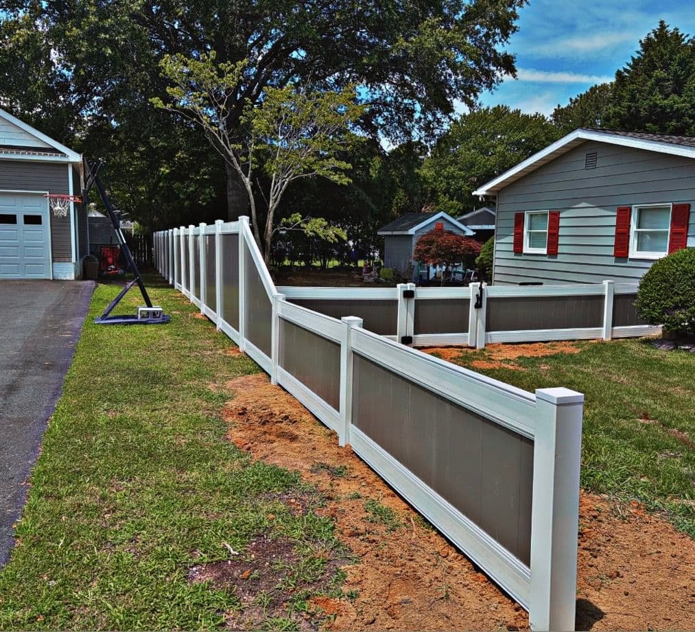 Gallery photos for Two-Tone Vinyl Fence with a Stepped Slope and Clean Gate Finish: Image #3