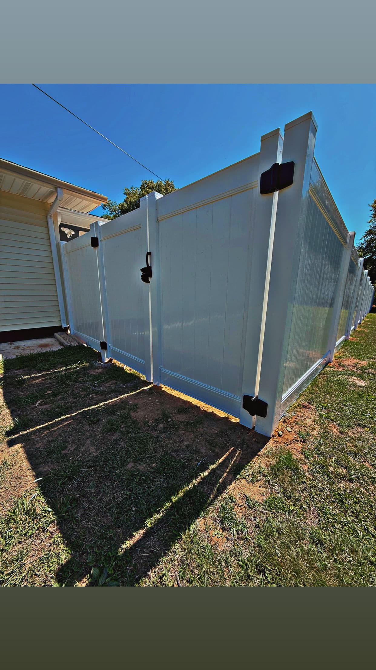 Gallery photos for White Vinyl Privacy Fence With a Custom Height Transition: Image #4